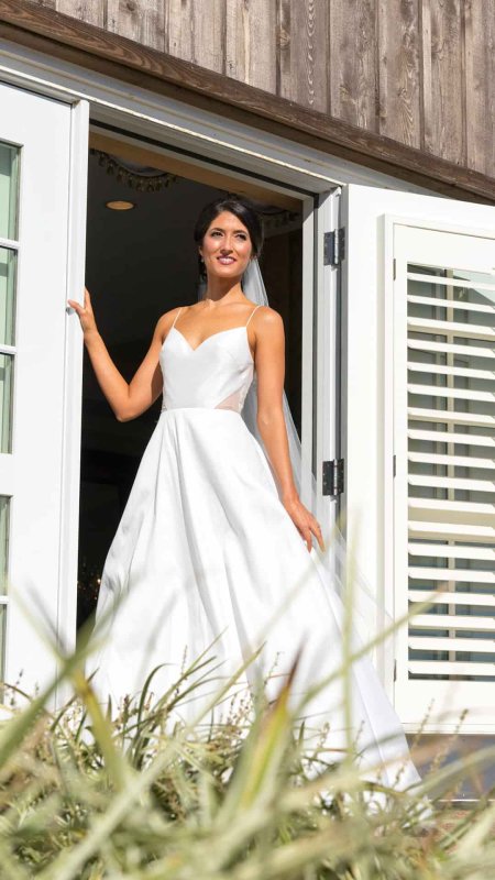 Full-length view of a stunning bride with professional hair and makeup – BRIDEface Richmond